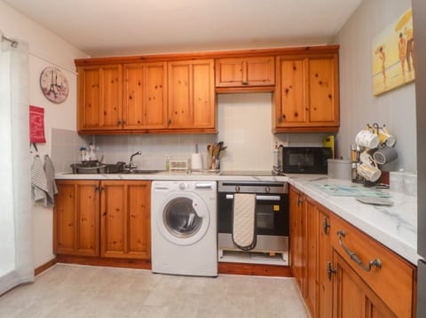 Fridge, electric kettle, toaster, cookware/dishes/utensils