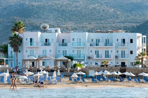 On the beach, sun loungers, beach umbrellas, rowing