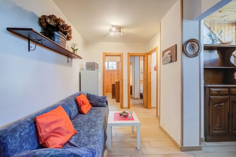 Standard Apartment, 2 Bedrooms (La Tana Dell'Ermellino 3 Ski In Ski) | Living area | 21-inch Smart TV with cable channels