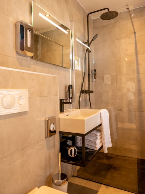 Shower, hydromassage showerhead, hair dryer, towels