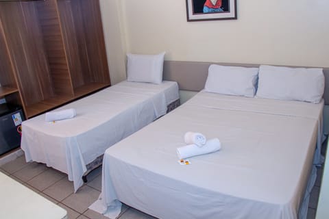 Standard Triple Room | Hypo-allergenic bedding, minibar, desk, free WiFi