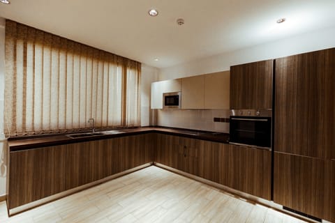 Grand Apartment | Private kitchen | Fridge, microwave, oven, cookware/dishes/utensils