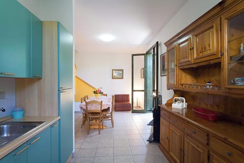 Standard House, 2 Bedrooms, 2 Bathrooms (Villetta dei Pini with pool in) | Private kitchen | Fridge, stovetop, coffee/tea maker, cookware/dishes/utensils