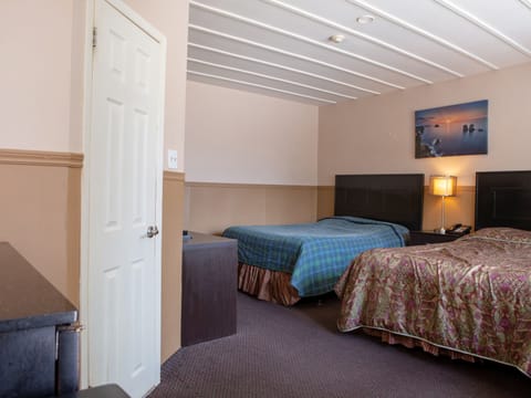 Premium Room, 2 Queen Beds | Iron/ironing board, free WiFi, bed sheets