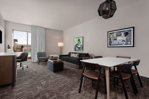 Suite, 1 King Bed, Patio, Poolside | Living area | 43-inch Smart TV with digital channels, Netflix, pay movies