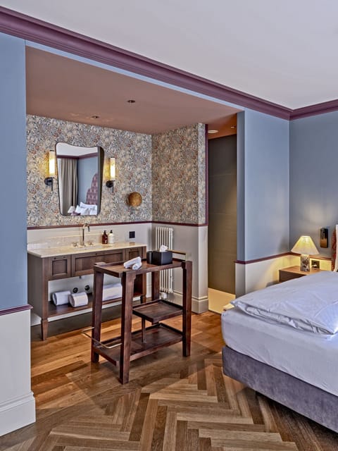 Hypo-allergenic bedding, down comforters, minibar, in-room safe