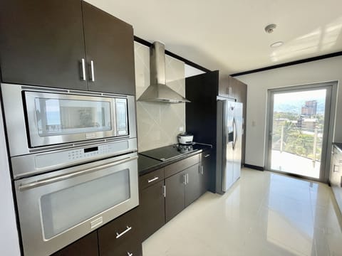 Condo, 4 Bedrooms | Private kitchen | Fridge, coffee/tea maker, toaster