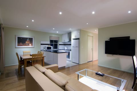 3 Bedroom Apartment | Living area | Flat-screen TV