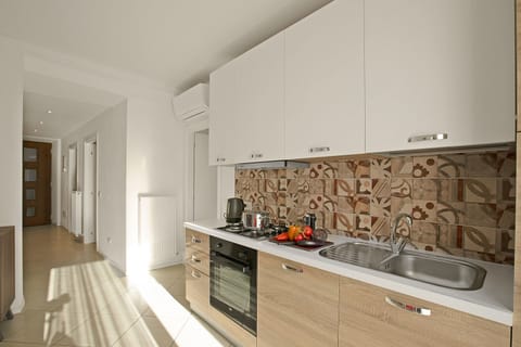 Family Apartment, 2 Bedrooms, Mountainside (La Leonessa) | Private kitchen | Fridge, microwave, oven, stovetop