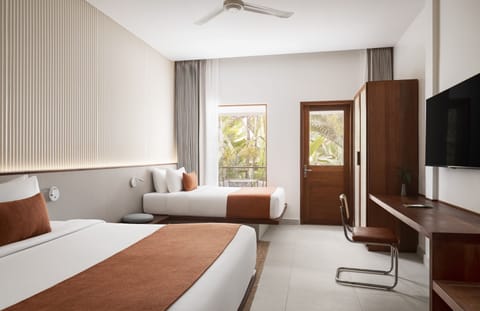 Deluxe Room Pool View | Minibar, in-room safe, desk, iron/ironing board