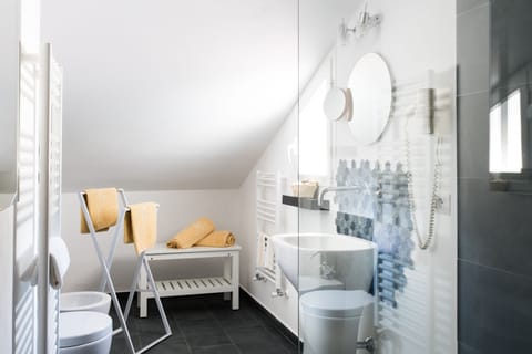 Junior Suite | Bathroom | Rainfall showerhead, hair dryer, bathrobes, slippers