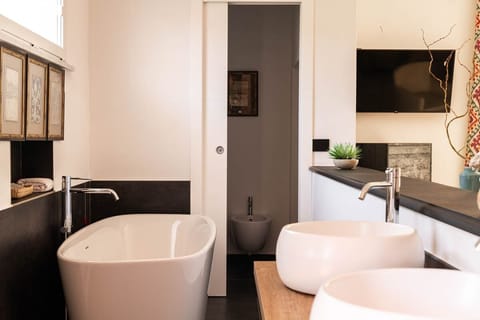 Suite, 1 Bedroom | Bathroom | Rainfall showerhead, hair dryer, bathrobes, slippers