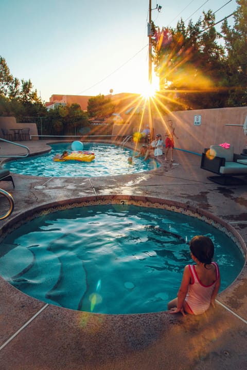 Seasonal outdoor pool, open 7:00 AM to 9:00 PM, pool umbrellas
