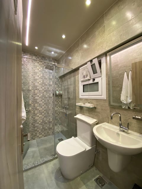 Family Room, Multiple Beds, Balcony | Bathroom | Combined shower/tub, rainfall showerhead, free toiletries, hair dryer