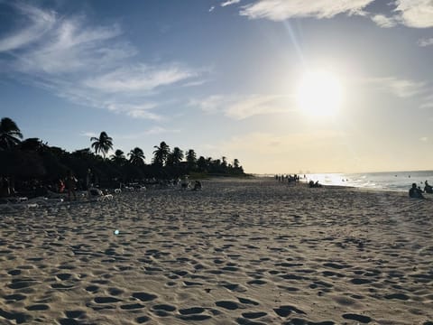 Beach nearby, white sand, beach towels