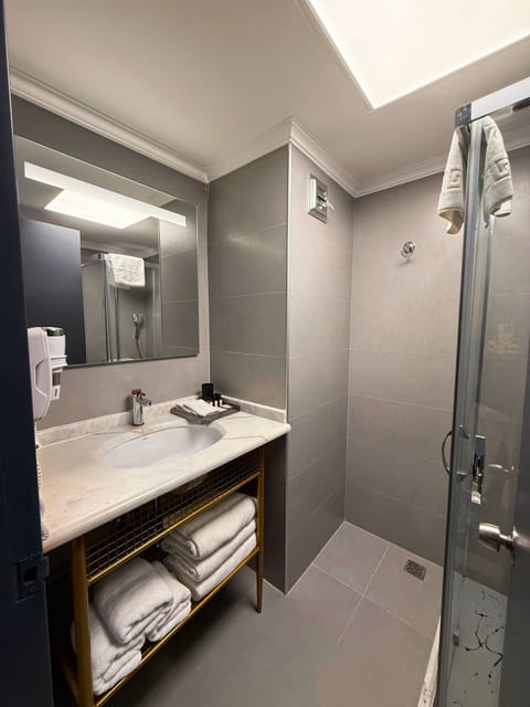 Family Room | Bathroom | Shower, designer toiletries, hair dryer, slippers