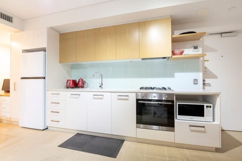 Luxury Apartment, 1 Bedroom, Beach View, Beachfront | Private kitchen | Full-size fridge, microwave, stovetop, dishwasher