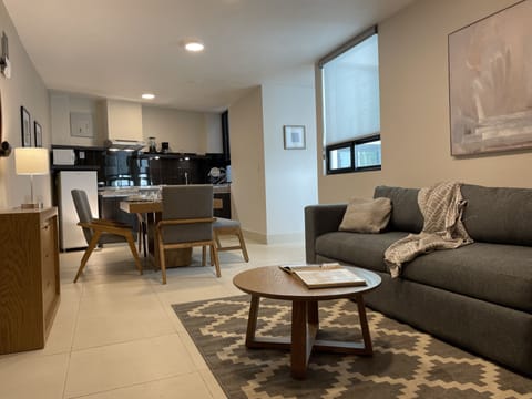 Deluxe Apartment, Terrace | Living area | 50-inch LED TV with digital channels, Netflix, streaming services