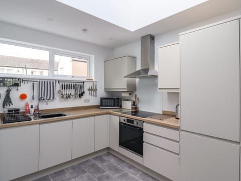 Fridge, dishwasher, electric kettle, cookware/dishes/utensils