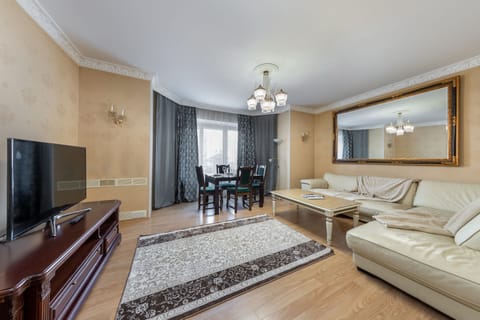 Luxury Apartment | Living area | 65-inch LCD TV with cable channels