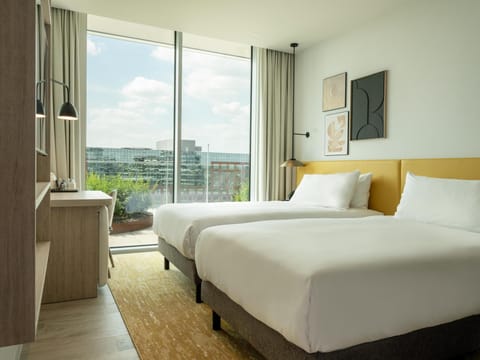 Premium bedding, down comforters, minibar, in-room safe