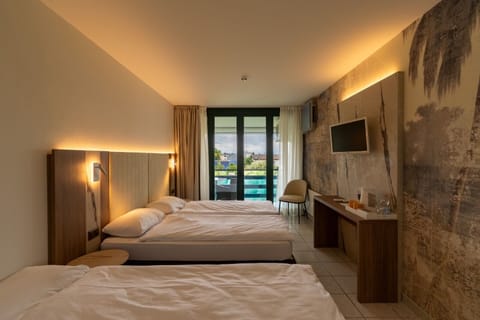 Family Triple Room | In-room safe, desk, blackout drapes, soundproofing