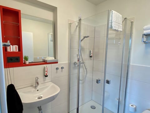 Standard Studio | Bathroom | Shower, hair dryer, towels, soap