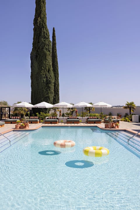 Outdoor pool, open 9:00 AM to 10:00 PM, pool umbrellas, sun loungers