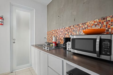 Comfort Apartment, 1 Bedroom | Private kitchen | Mini-fridge, microwave, coffee/tea maker, blender