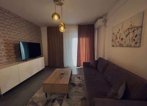 Exclusive Apartment | Living area | 55-inch Smart TV with premium channels