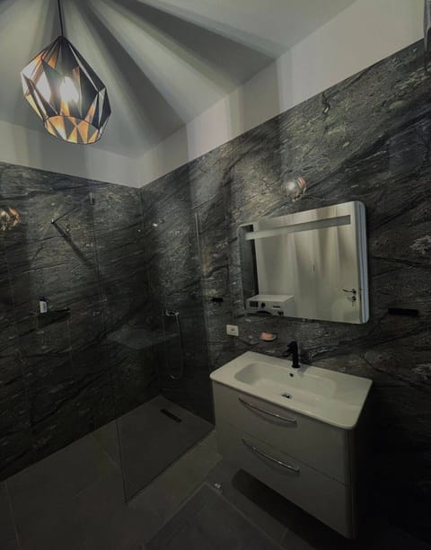 Exclusive Apartment | Bathroom | Shower, rainfall showerhead, free toiletries, hair dryer