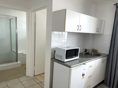 Apartment, 1 King Bed with Sofa bed | Private kitchen | Full-size fridge, microwave, electric kettle, toaster