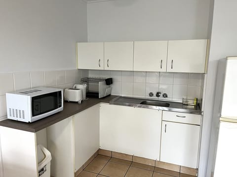 Apartment, 1 Bedroom | Private kitchen | Full-size fridge, microwave, electric kettle, toaster