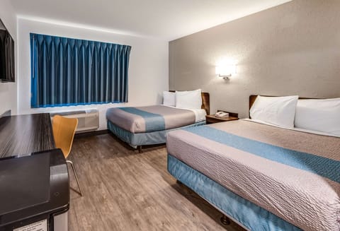 Desk, laptop workspace, blackout drapes, iron/ironing board