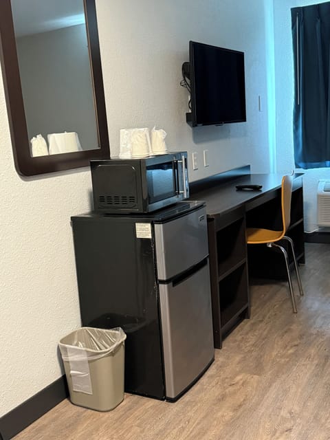 Desk, laptop workspace, blackout drapes, iron/ironing board