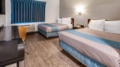 Desk, laptop workspace, blackout drapes, iron/ironing board