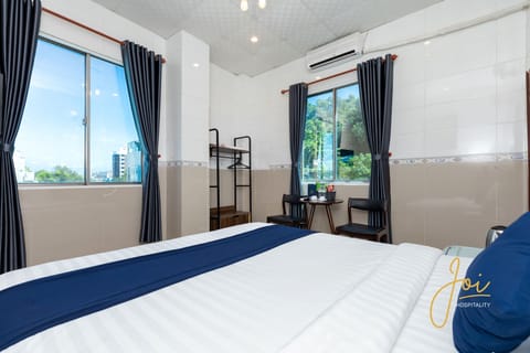 Deluxe Double Room, Beach View | Desk, iron/ironing board, free WiFi, bed sheets