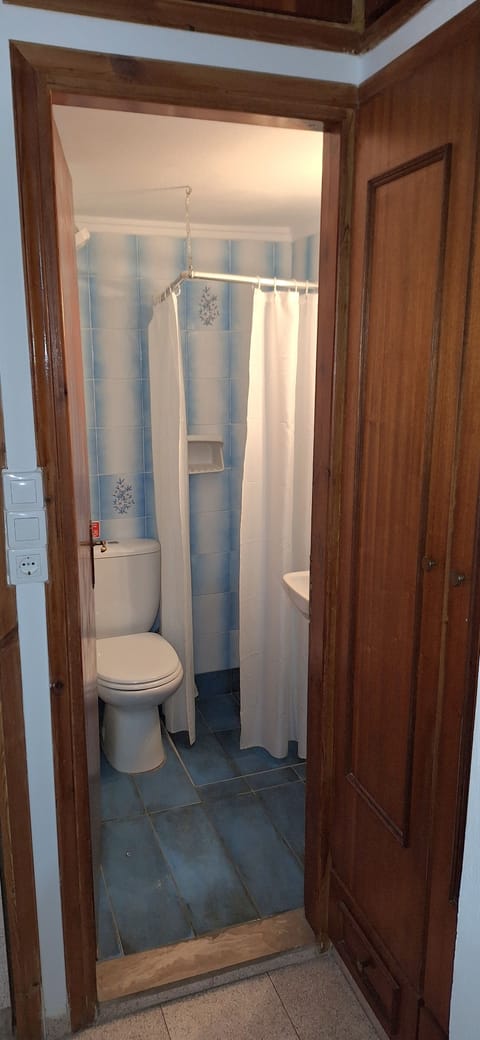 Shower, hair dryer, towels, toilet paper