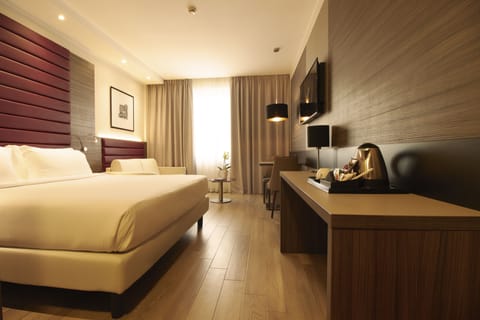 Premium bedding, down comforters, minibar, in-room safe