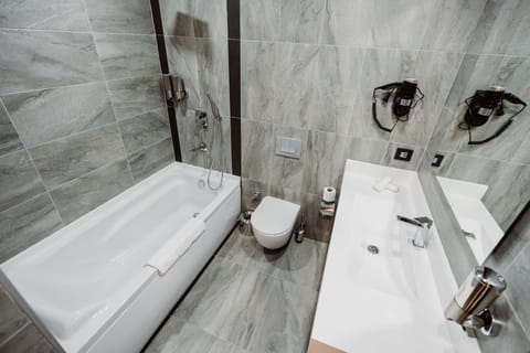 Suite, Multiple Beds, Non Smoking, Kitchenette (Separate Living Room;with Sofabed) | Bathroom | Rainfall showerhead, free toiletries, hair dryer, bathrobes