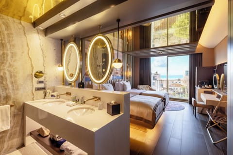 Deluxe Room | Bathroom | Shower, rainfall showerhead, designer toiletries, hair dryer