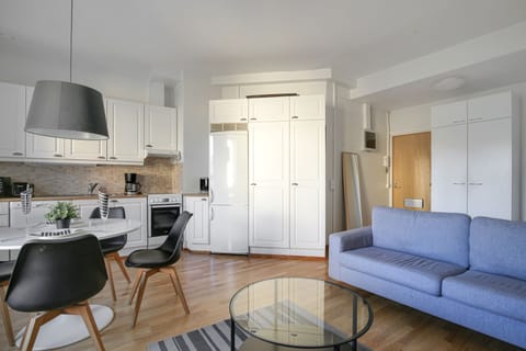 Basic Apartment, City View | Living area | Flat-screen TV