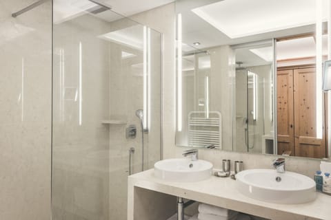 Designer toiletries, hair dryer, bathrobes, slippers