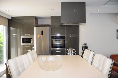 Exclusive Villa | Private kitchen | Full-size fridge, microwave, oven, stovetop