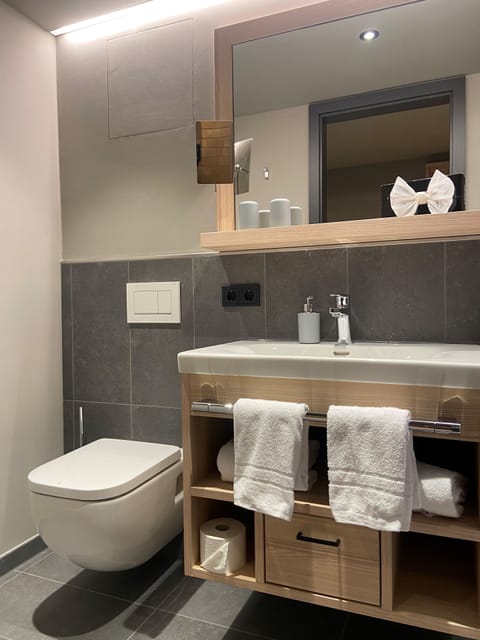 Shower, rainfall showerhead, hair dryer, heated floors