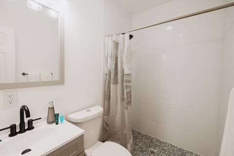 Ocean View, Patio, Classic Room 3 - Guana G's Room | Bathroom | Shower, hair dryer, towels, soap