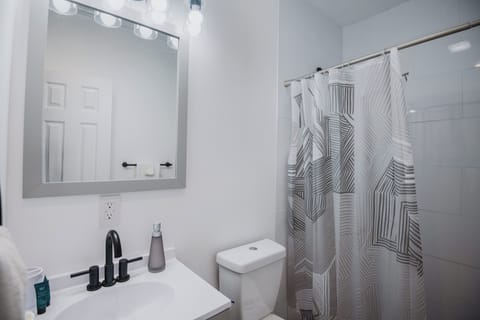 Ocean View, Patio, Classic, Room 2, Captain J's Room | Bathroom | Shower, hair dryer, towels, soap