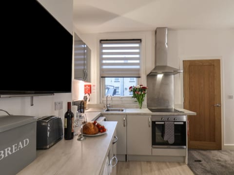 Fridge, electric kettle, toaster, cookware/dishes/utensils