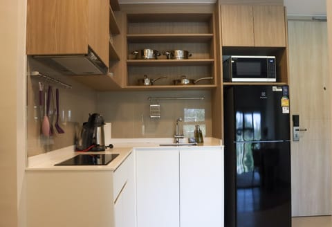 Deluxe Apartment, 2 Bedrooms | Private kitchen | Full-size fridge, microwave, stovetop, coffee/tea maker