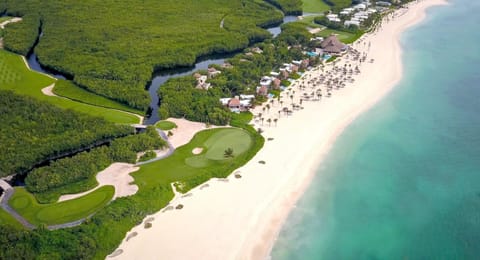 On the beach, white sand, sun loungers, beach umbrellas